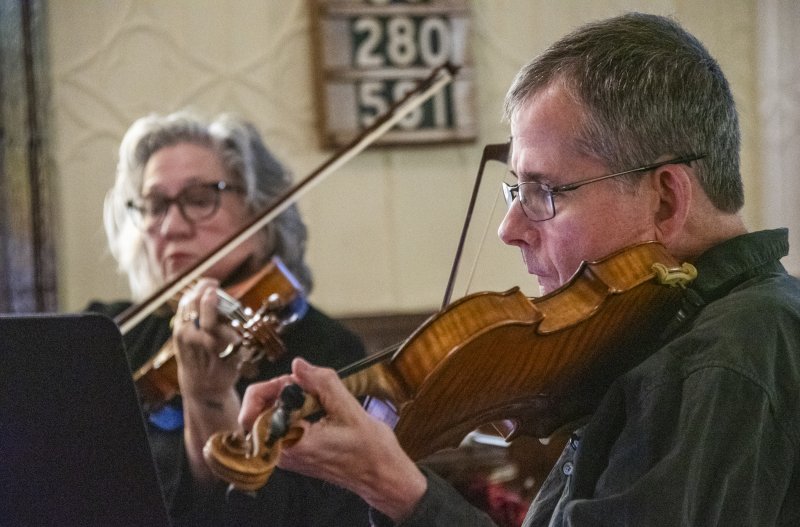 Shrewsbury String Quartet first violinist William Phillips and Diane Baxter Neutzling on viola perform a sonata.